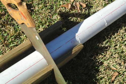 Using a saw and a slotted box to cut a slot to be shaped later.