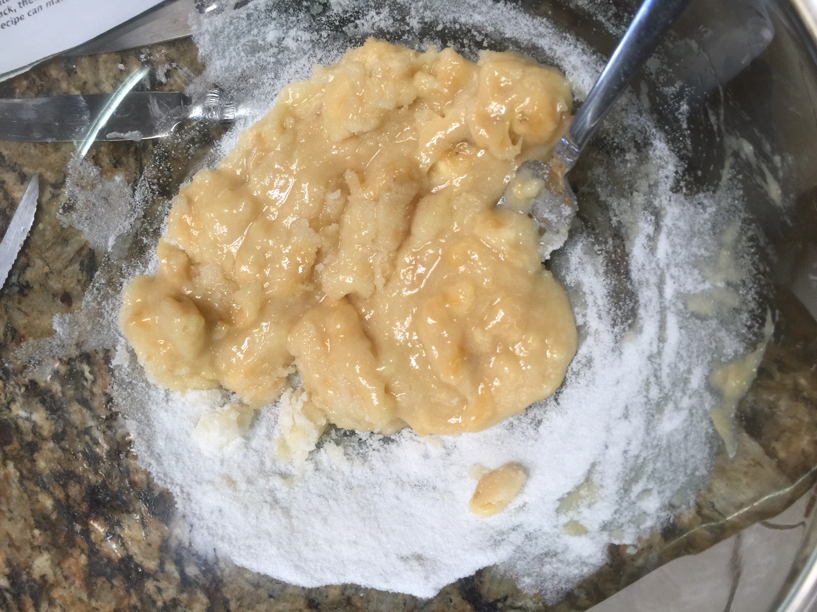 Mixing with the sugar after mashing. The golden center flesh is still  visible. 